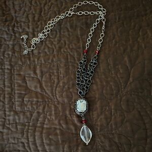 Elegant Silver and Black Necklace with Red Accents